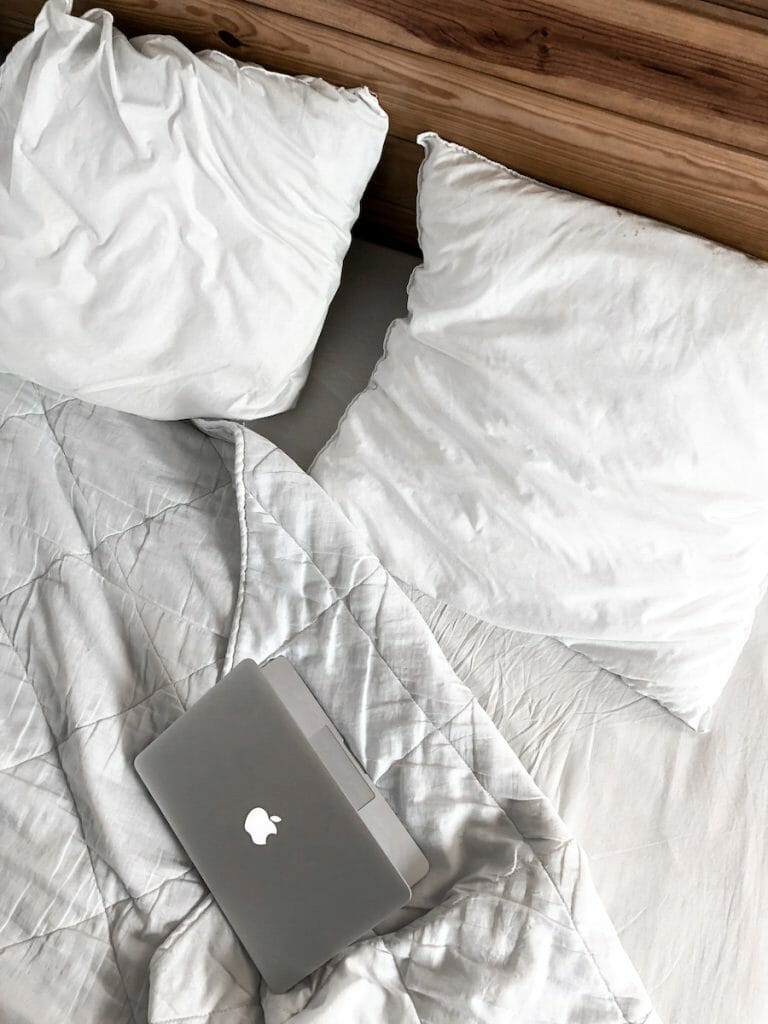 Macbook on a Messy Bed